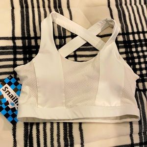 White sports bra. Brand is snailify on Amazon. Super cute and great support.
